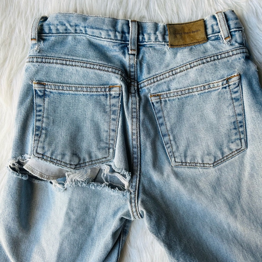 🔥SOLD🔥VINTAGE CALVIN KLEIN High Rise Ripped Arse Button Fly Light Wash Jeans